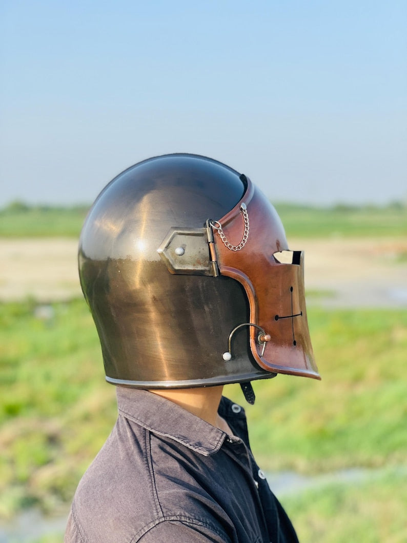 Close-up of the helmet in copper and grey, showcasing historical armor craftsmanship.