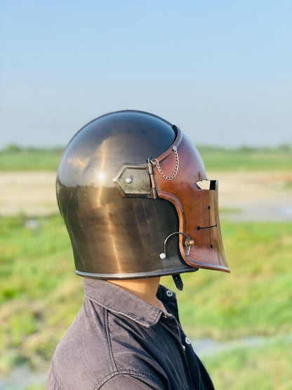 Close-up of the helmet in copper and grey, showcasing historical armor craftsmanship.