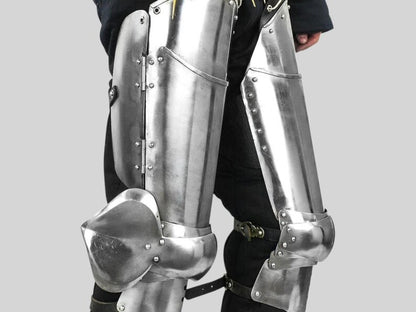 Side profile of knight leg armor set showing cuisse and poleyn articulation


