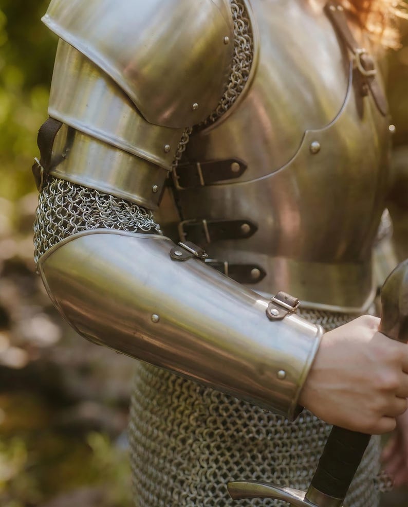 Side view of ladies chainmail cuirass armor for LARP and fantasy cosplay, highlighting hand-forged steel and chainmail details