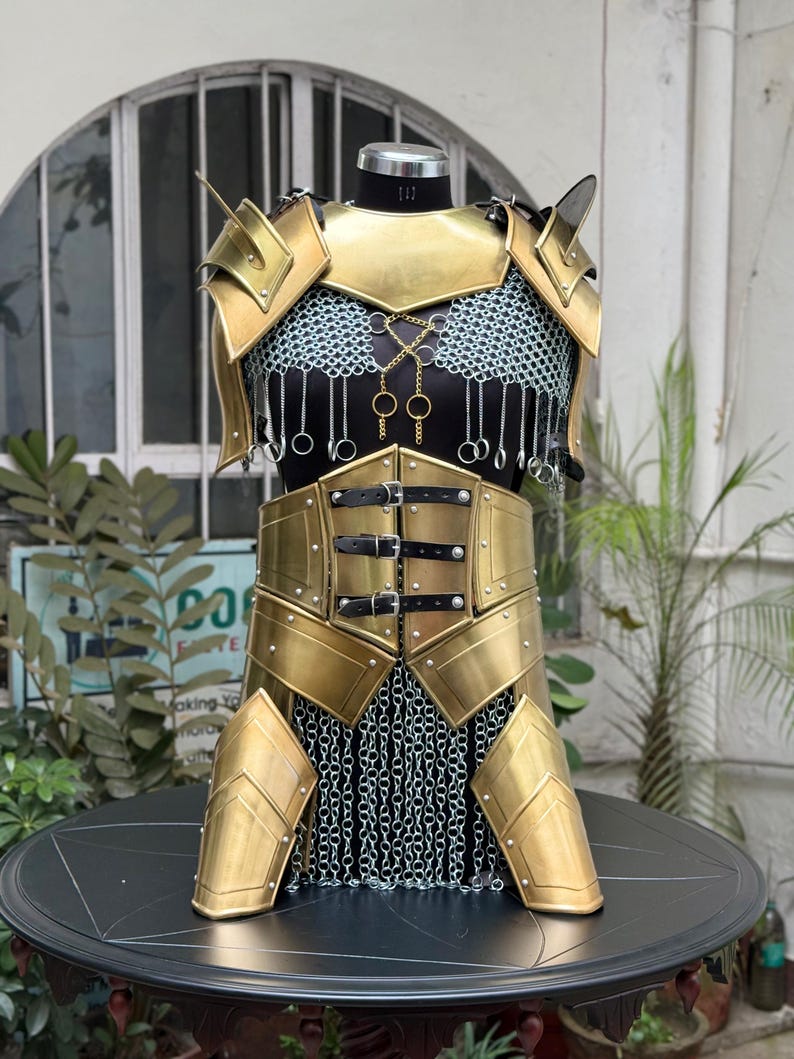 Side view of LARP costume armor set with pauldrons and bracers for women