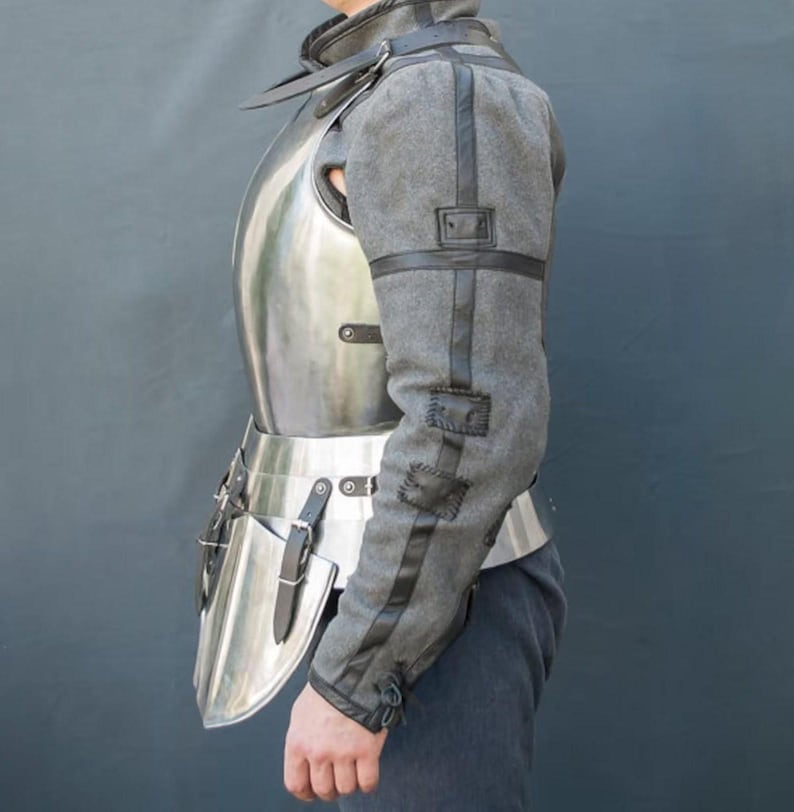 Close-up of handmade medieval armor cuirass and tassets with riveted steel