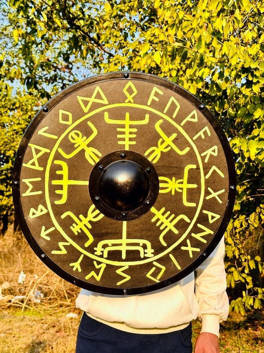 Side angle of medieval Viking costume shield showing wood texture and metal trim