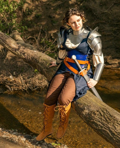 Complete Lady of Steel knight armor displayed in a medieval-inspired setting, perfect for cosplay, LARP, or Renaissance fairs.


