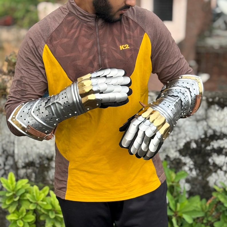 Handcrafted medieval gauntlets with polished metallic finish and claw detailing
