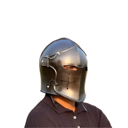 Side profile of the medieval Barbuta helmet showing the contoured visor and durable steel construction.