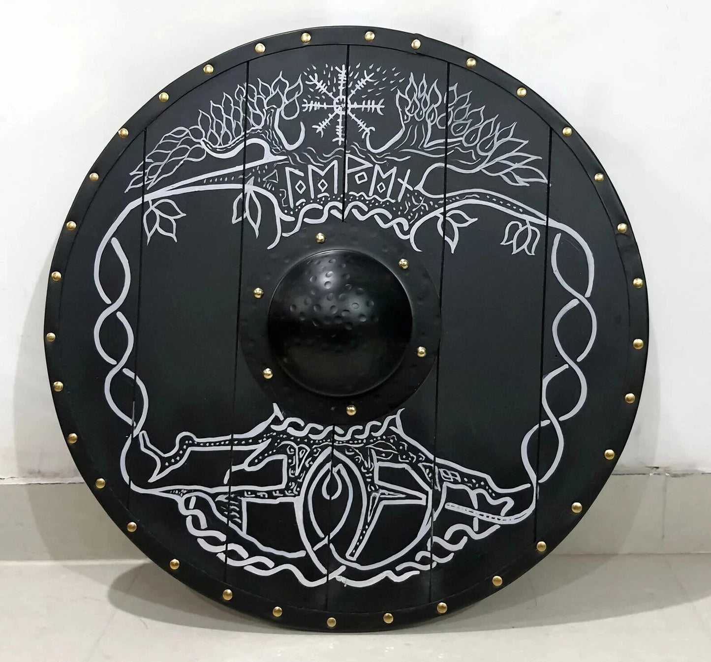 Back side of wearable Norse wooden shield showing leather straps