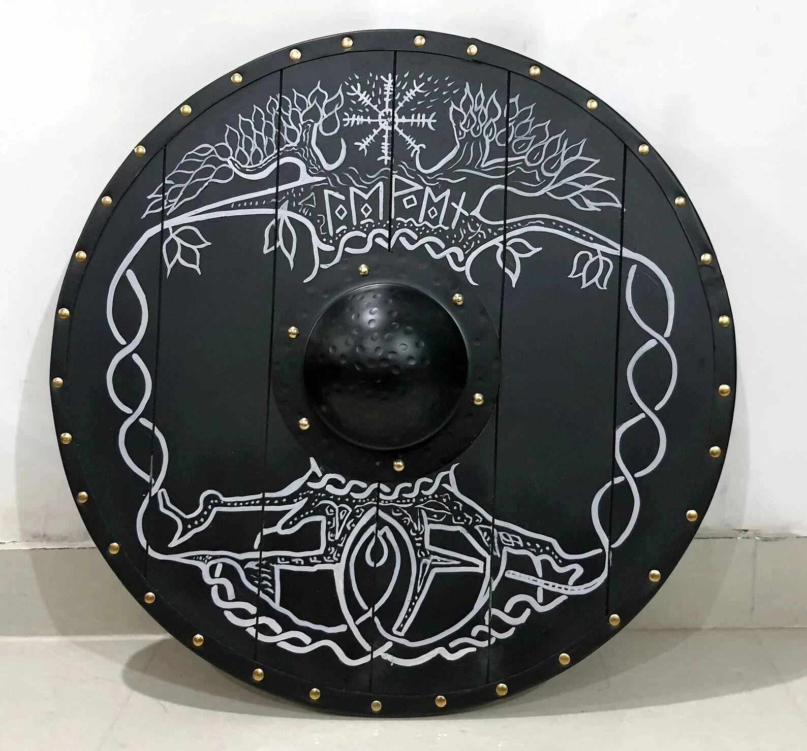 Back side of wearable Norse wooden shield showing leather straps