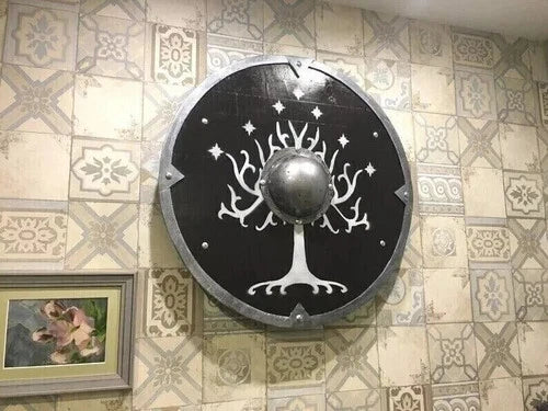 Norse round wooden shield mounted as medieval wall decor with symbolic design