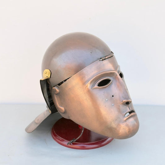Front view of medieval Roman cavalry face helmet with leather chinstraps for reenactment and LARP