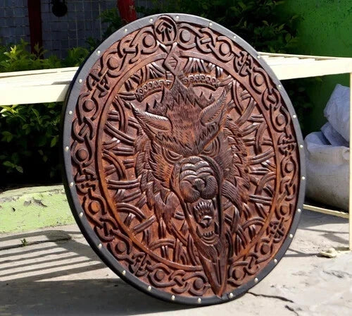 Side angle showing the 22-inch medieval Viking shield with battle-worn finish