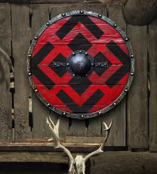 Front view of handmade medieval Viking wooden shield with metal fittings