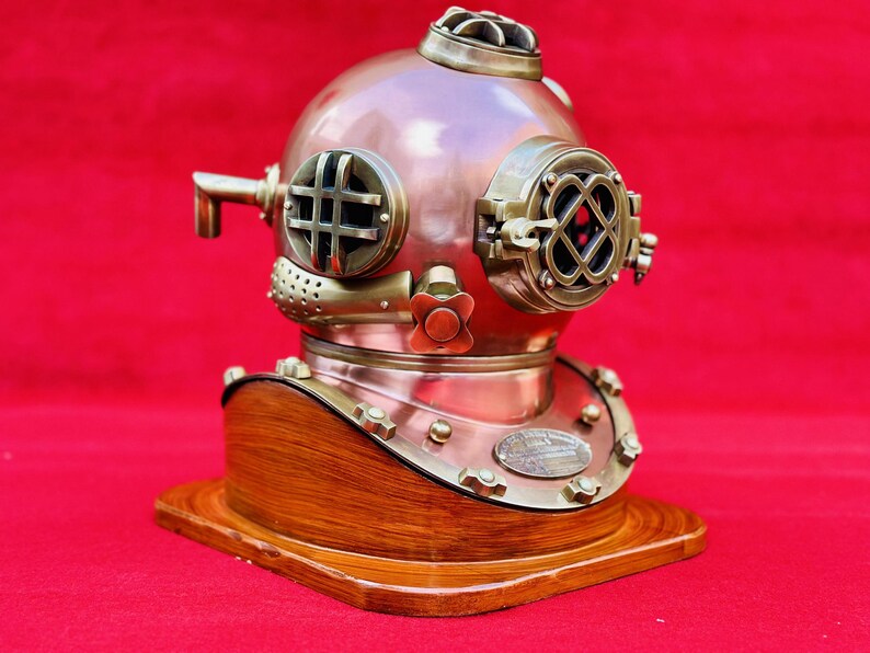 Nautical decor featuring U.S. Navy Mark V Diving Helmet on wooden base as tabletop display