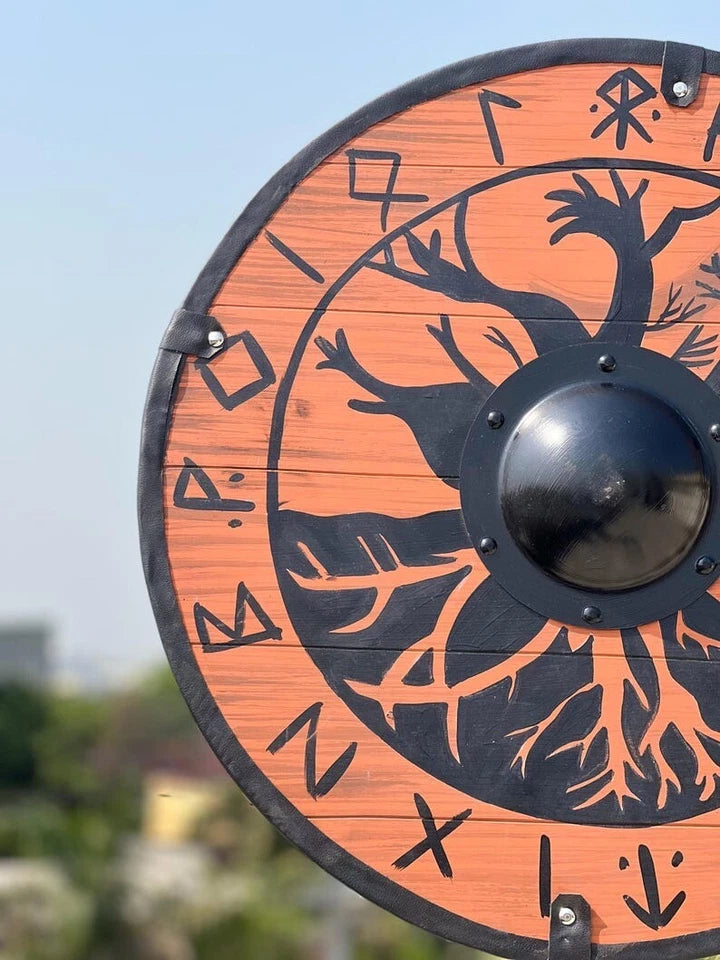 Viking wooden shield mounted as medieval Norse wall decoration