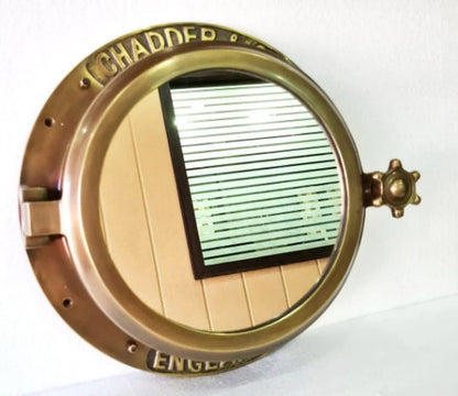 Wall-mounted porthole mirror perfect for pirate or nautical themed decor