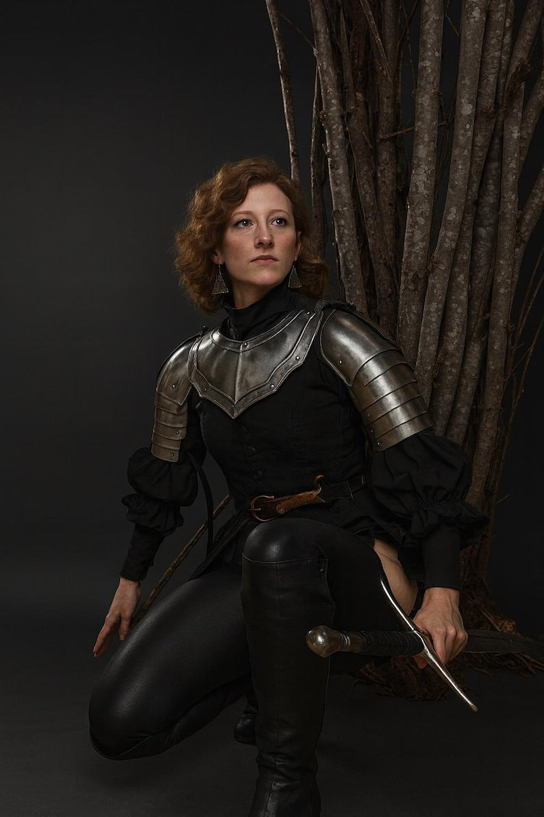 Polished steel pauldron and gorget from medieval armor set for cosplay and fantasy events