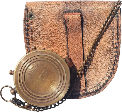 Close-up of the compass showing premium brass finish and inspirational engraved details.

