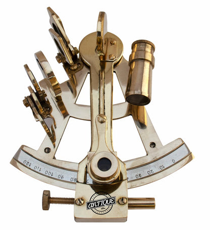 Brass sextant with 'antique' label on a white background