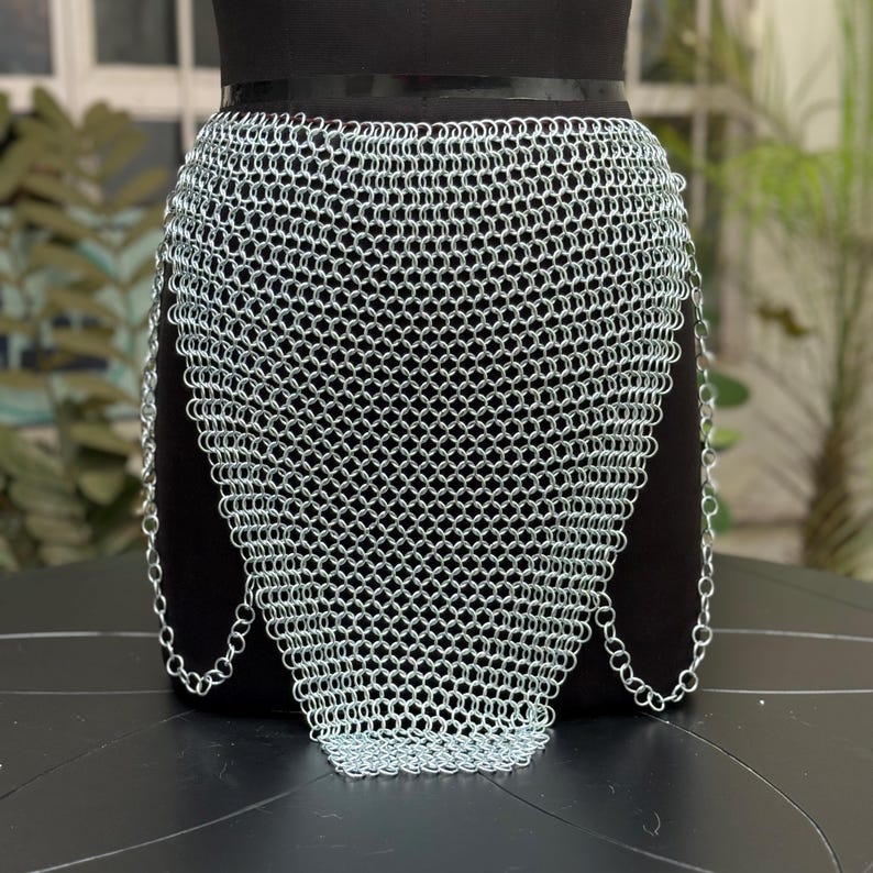 Statement chainmail top styled for music festivals and bold streetwear fashion with a warrior vibe