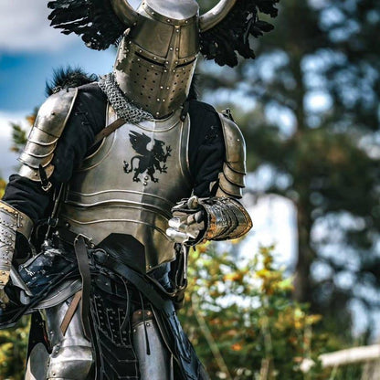 Articulated gauntlets with gold-accented detailing and engraved surfaces, offering full hand protection in the knight armor set.


