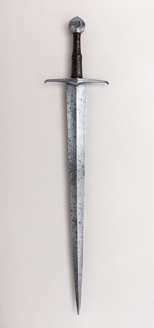Hand-forged Viking axe with carved wooden handle

