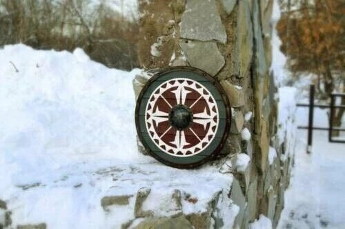 24-inch Viking shield displayed as wall-mounted medieval decor