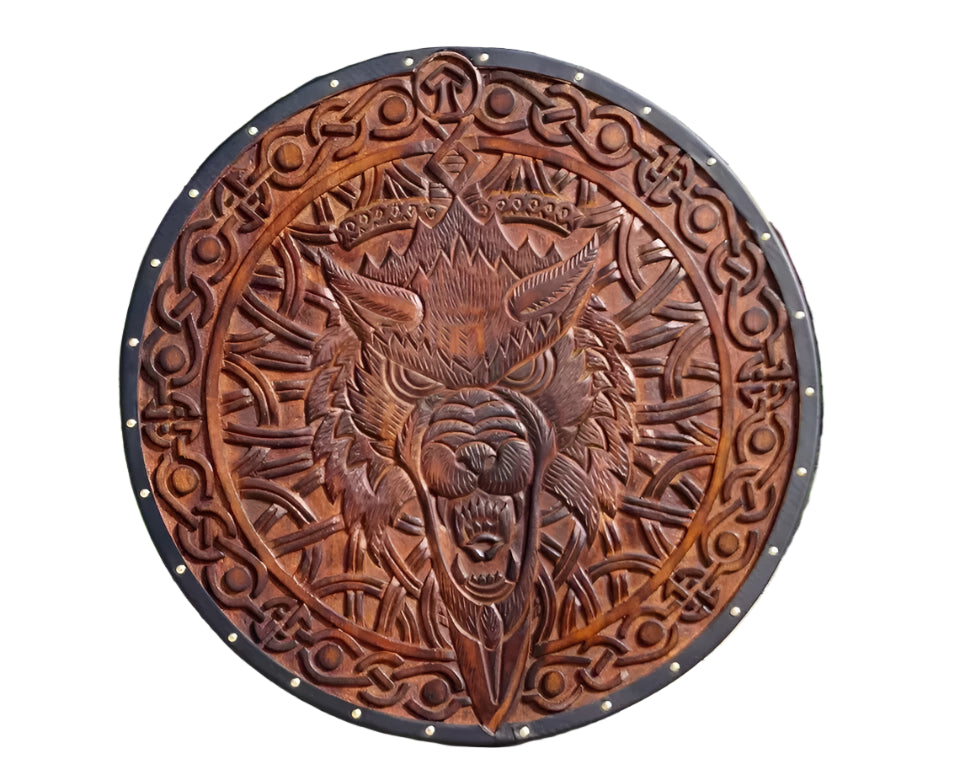 Front view of handmade wooden Viking shield with Norse wolf design