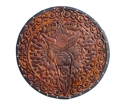Front view of handmade wooden Viking shield with Norse wolf design