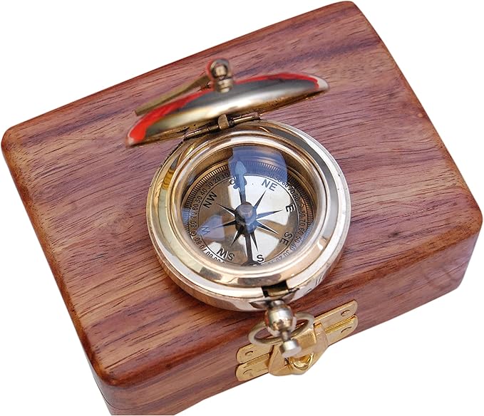 Vintage nautical sundial clock used as elegant desk or home décor item.

