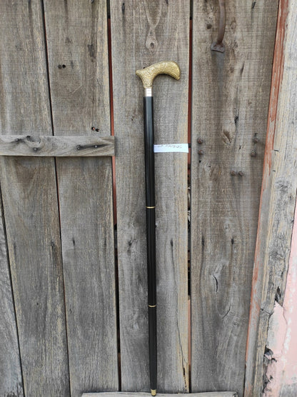Vintage solid wand cane displayed upright for collectors