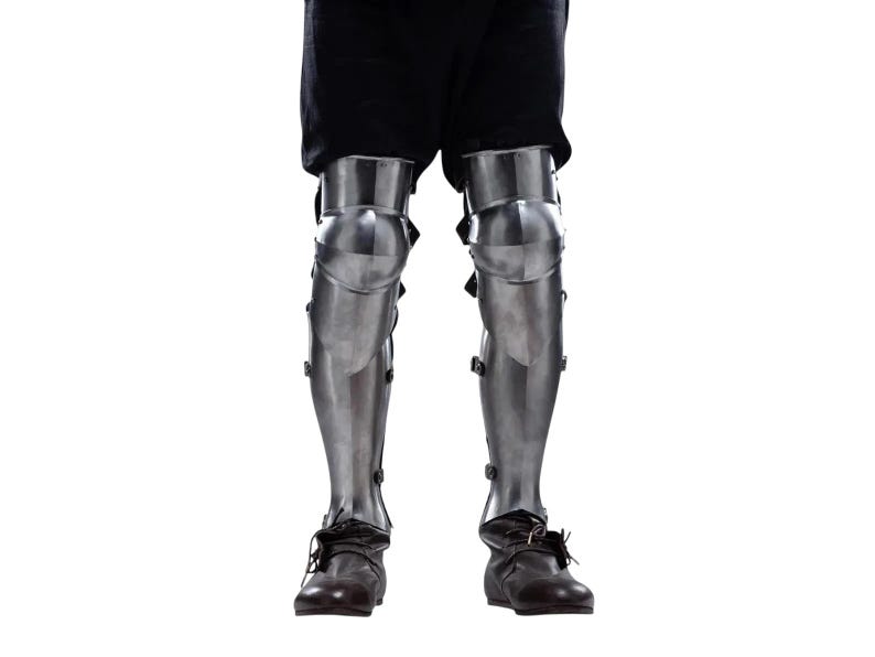 Wearable knight leg armor greaves with strong leather straps for adjustable fit used in LARP and medieval reenactment