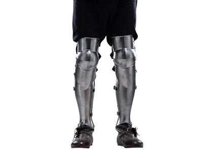 Wearable knight leg armor greaves with strong leather straps for adjustable fit used in LARP and medieval reenactment