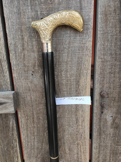 Wooden walking stick featuring polished engraved Derby handle
